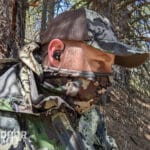 Hunter wearing ear buds hearing protection