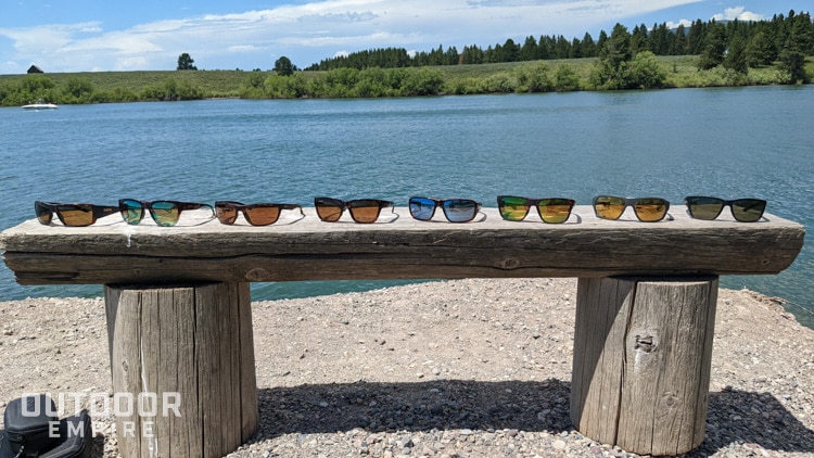 Eight pairs of best smith fishing sunglasses on a bench