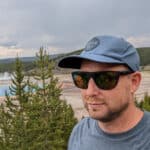 Man wearing smith barra sunglasses overlooking grand prismatic hot spring in yellowstone