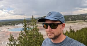 Man wearing Smith Barra sunglasses overlooking Grand Prismatic hot spring in Yellowstone