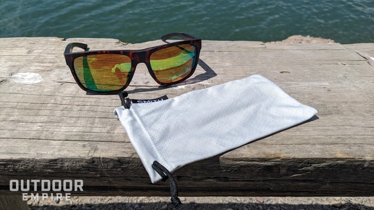 Smith Barra sunglasses on bench with case