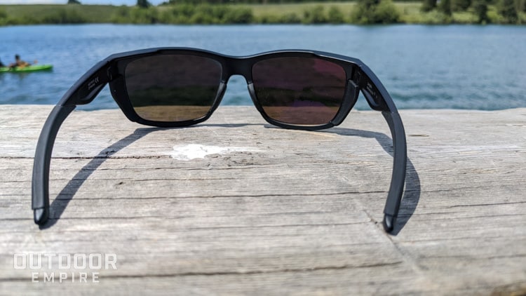 Looking through sunglasses from behind