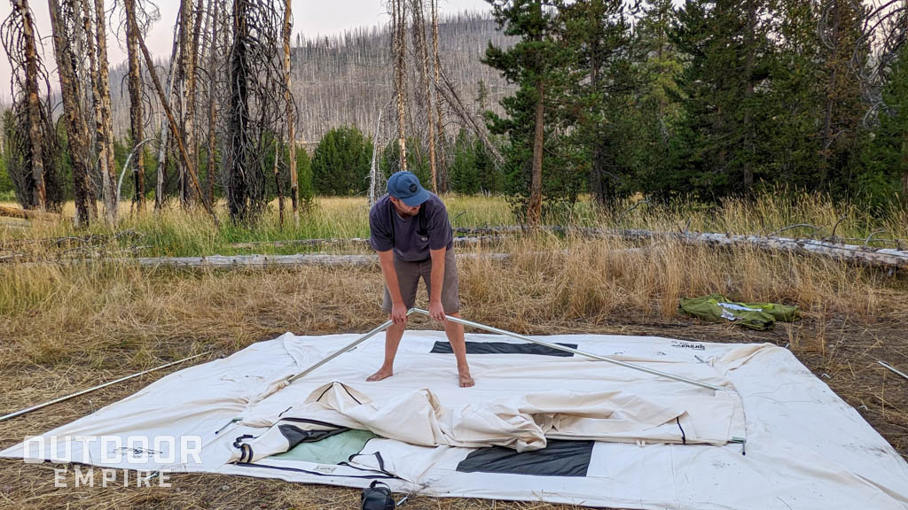 Man setting up Springbar tent
