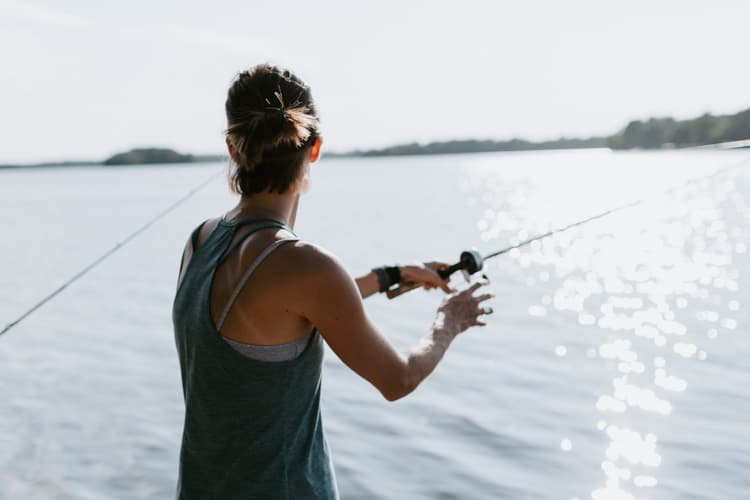 Woman fishing on a lake
