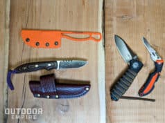 Different types of hunting knives on a table