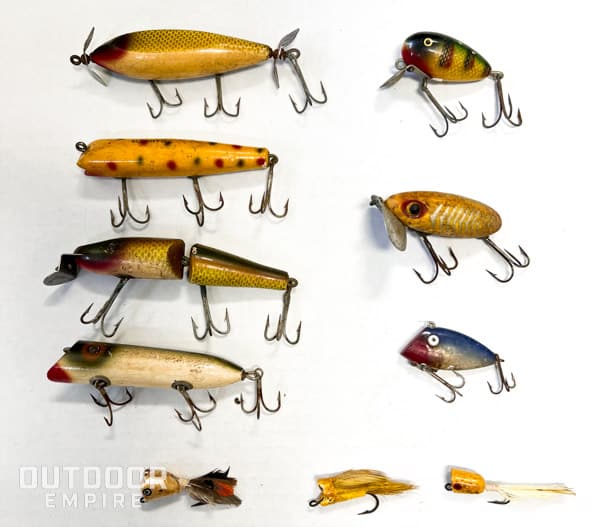 An assortment of old bass lures in yellow and natural colors that are favorable for fall bass fishing