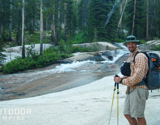 Man with ultralight backpack by river