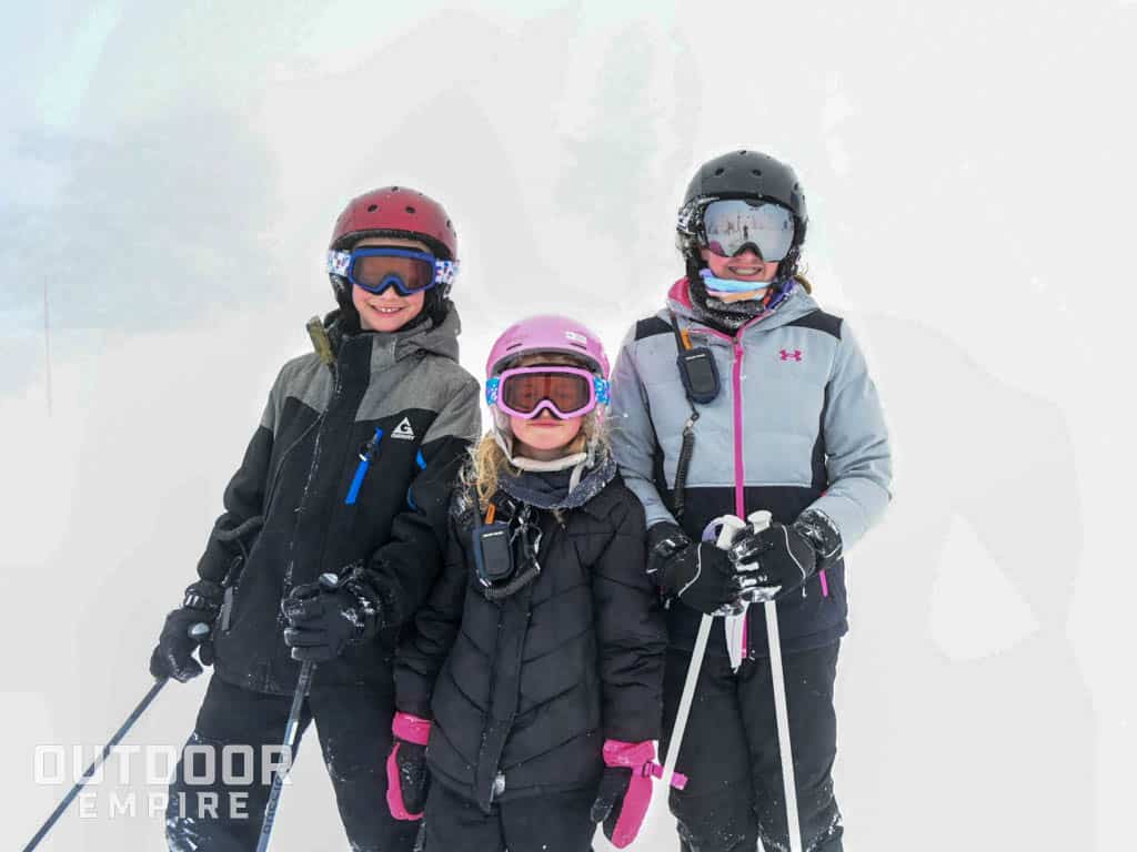 3 kids skiing with Rocky Talkies.