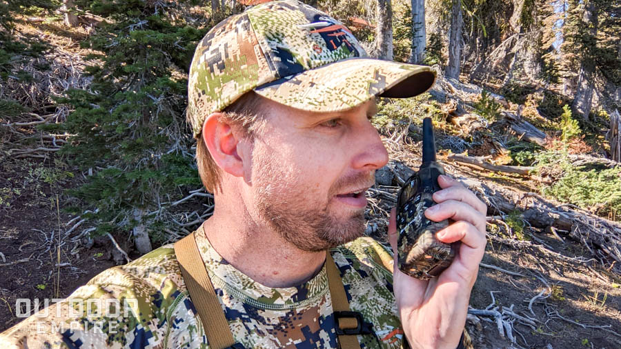 Hunter talking into walkie talkie