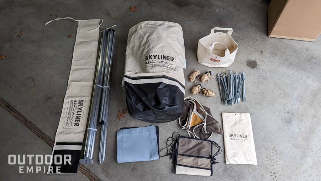 Springbar Skyliner bags and components on cement floor inside a garage
