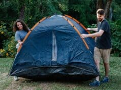 couple pitching tent