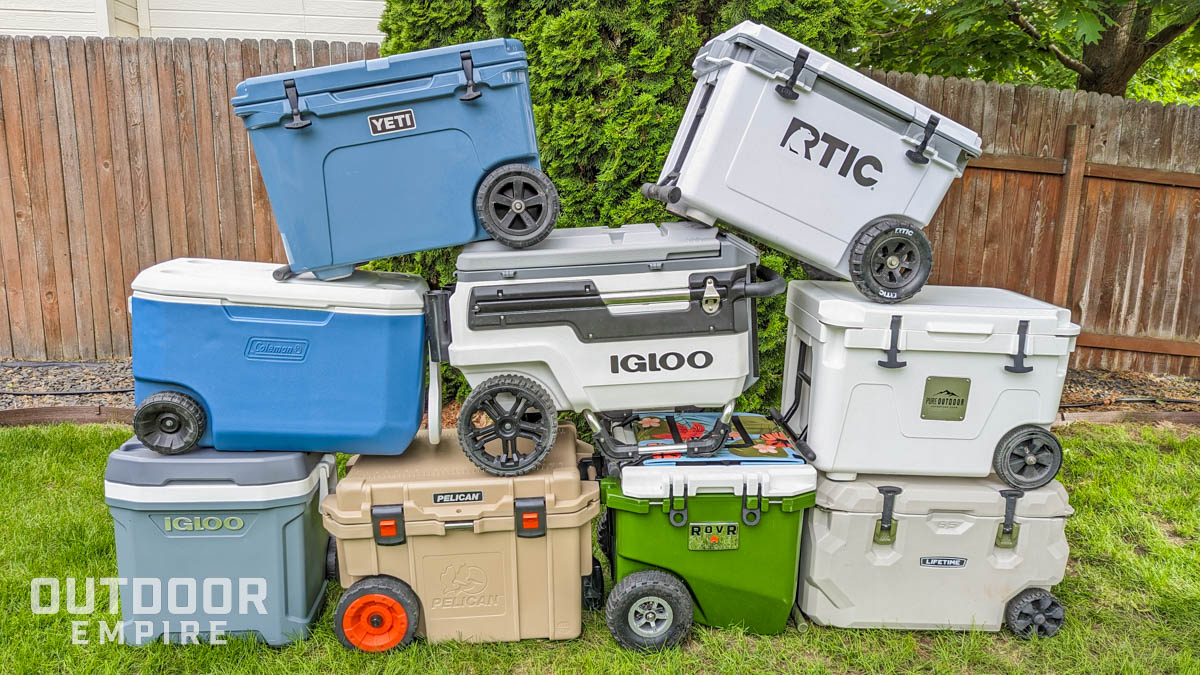 Nine of the best wheeled coolers stacked up in a backyard
