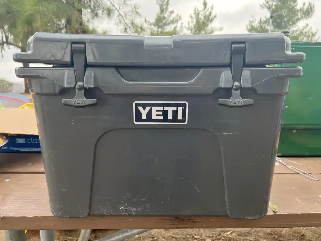 Cooler mistakes like leaving coolers in the sun can lead to warped lids like on this gray yeti cooler with big gap under lid.