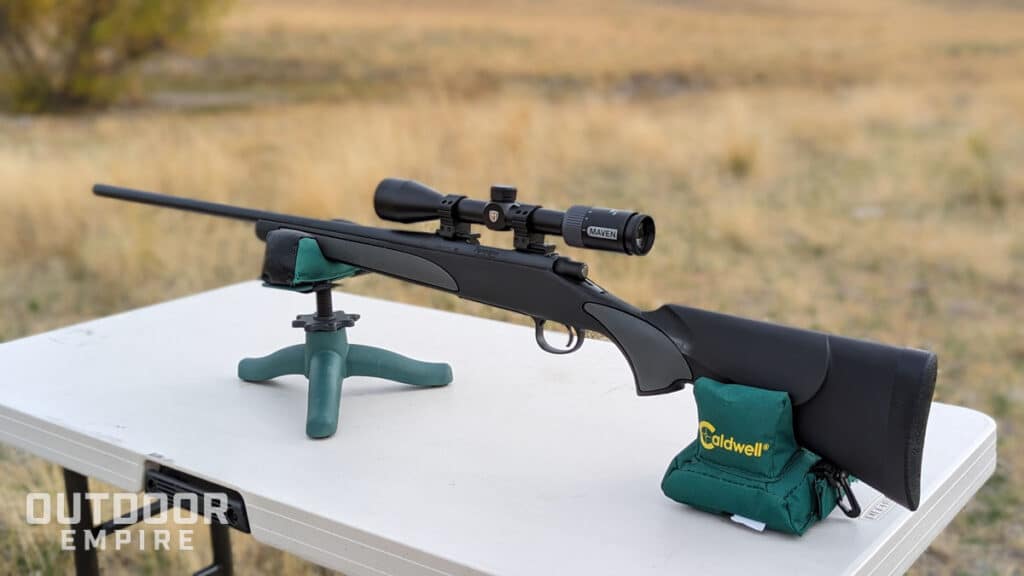Remington 700 sps. 308 winchester rifle sitting on a shooting bench