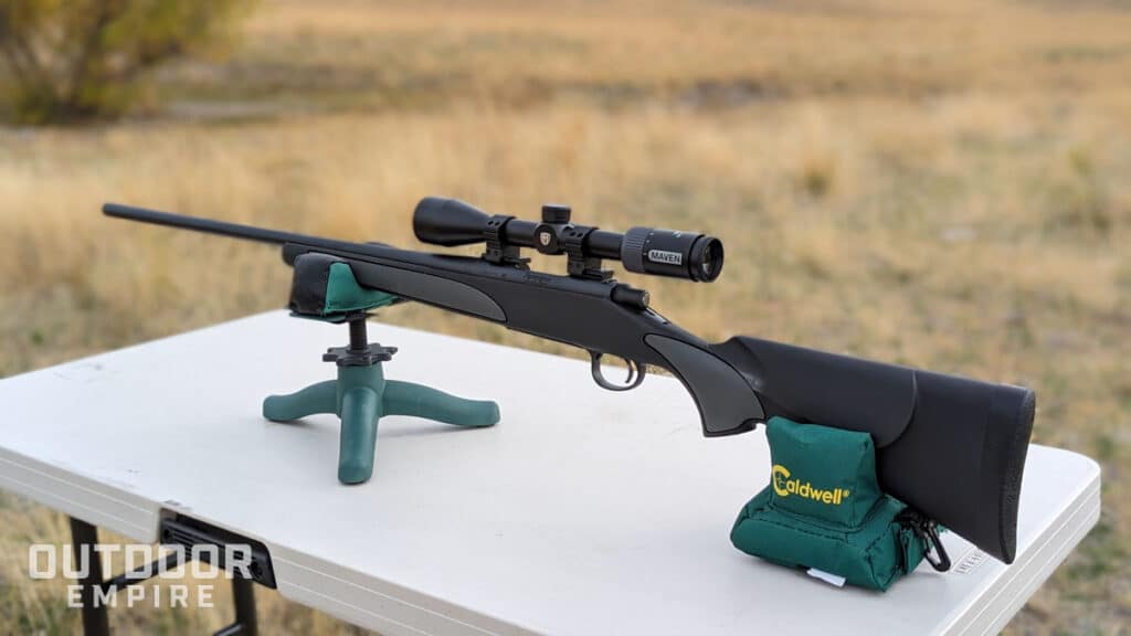 Remington 700 SPS .308 winchester rifle sitting on a shooting bench