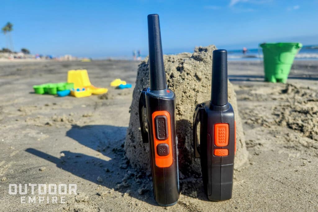 Large cobra walkie talkie next to smaller cobra radio for size comparison