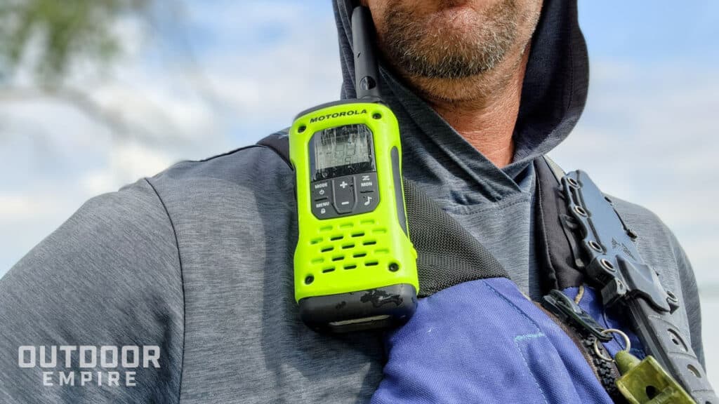 Motorola t600 walkie talkie up close attached to man's life vest