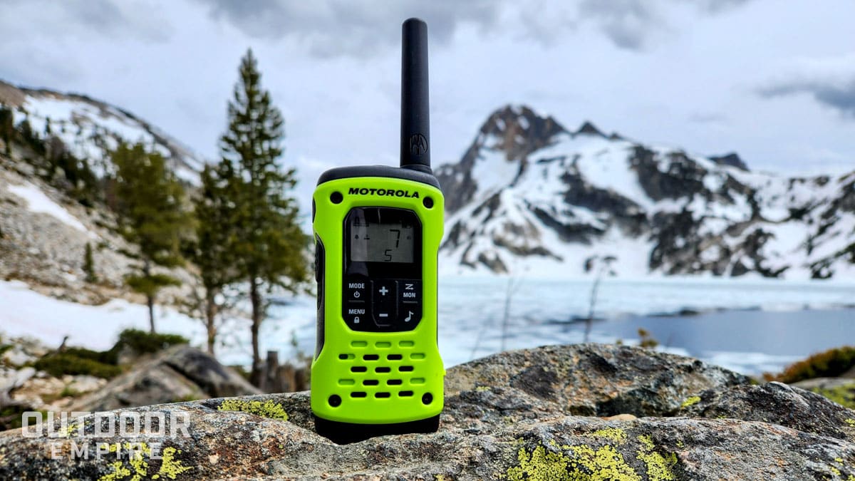 motorola talkabout t600 h2o walkie talkie sitting on rock in front of frozen mountain lake