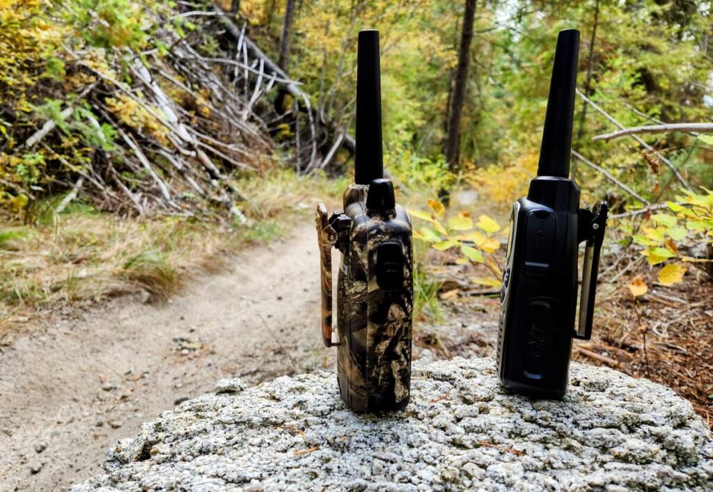 Midland gxt1000vp and midland 1050vp4 walkie talkies in the woods showing off their clip