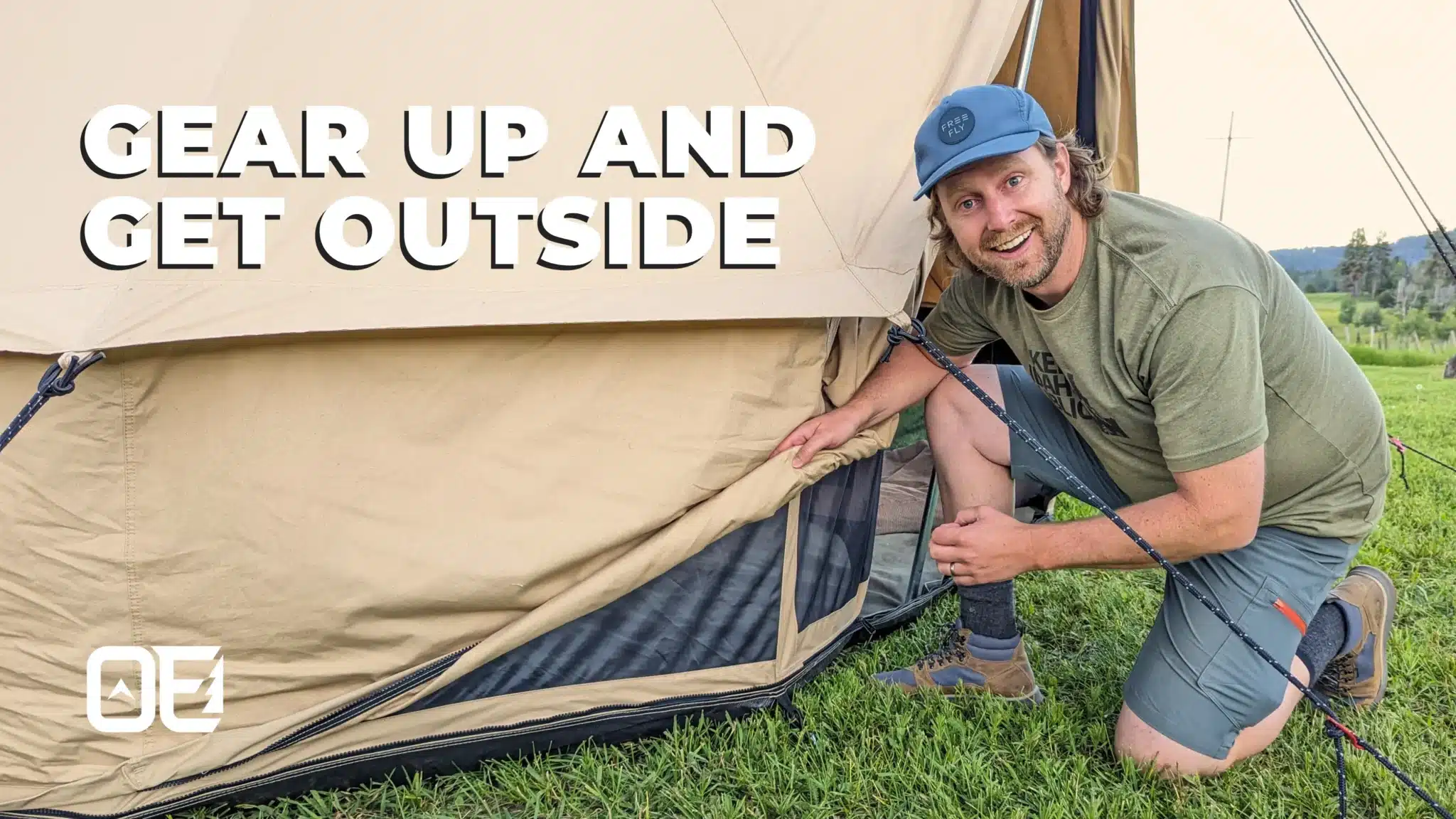 Chase fly doing one of his outdoor gear reviews with excited expression kneeling next to tent with words gear up and get outside on image
