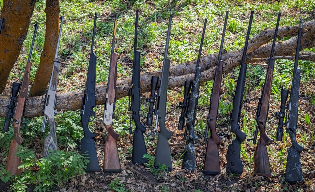 Best 30-06 rifles lined up along tree